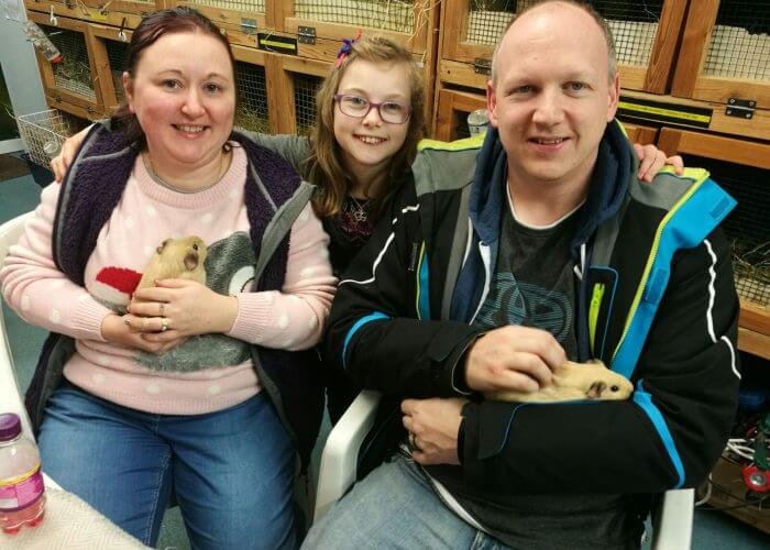 A family during an Adoption at Cavy Corner