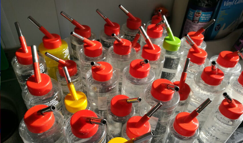 A crate of guinea pig water bottles