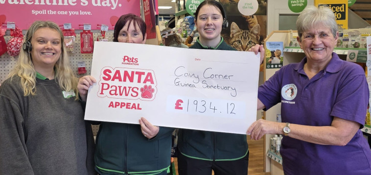 Pets at Home Selby staff and Cavy Corner Volunteer holding a large cheque.