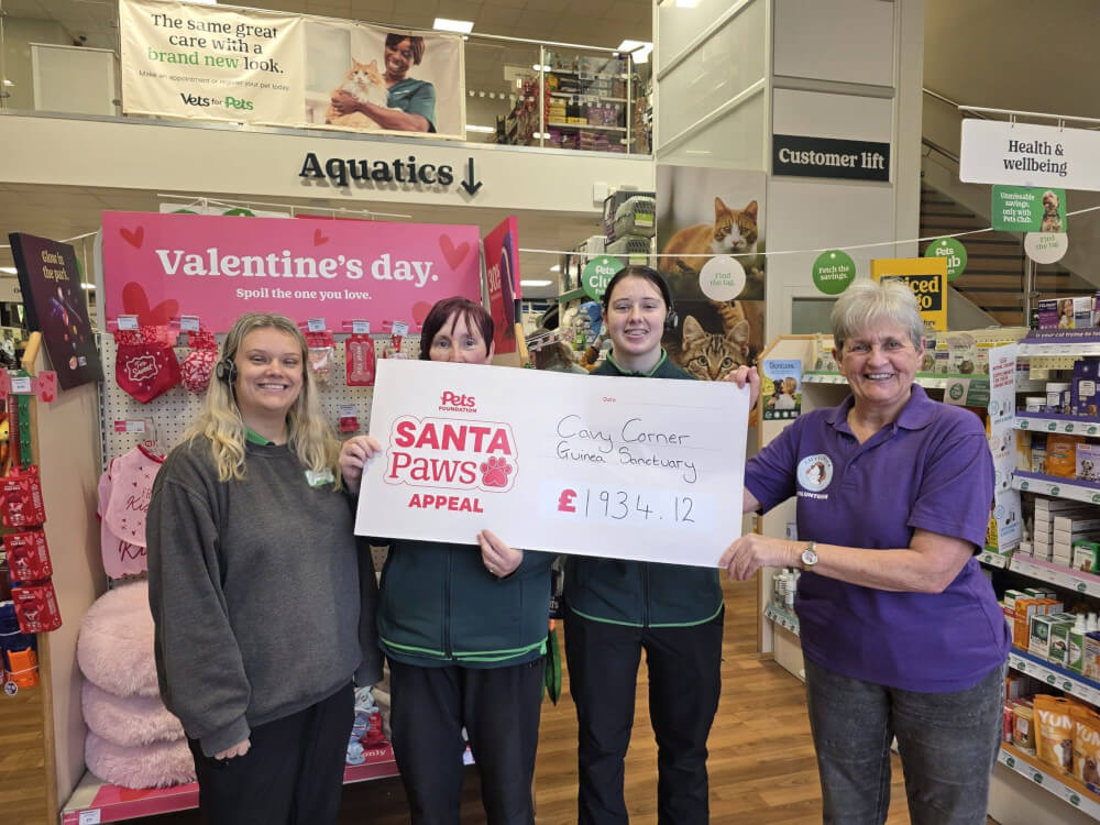 Pets at Home Selby staff and Cavy Corner Volunteer holding a large cheque.