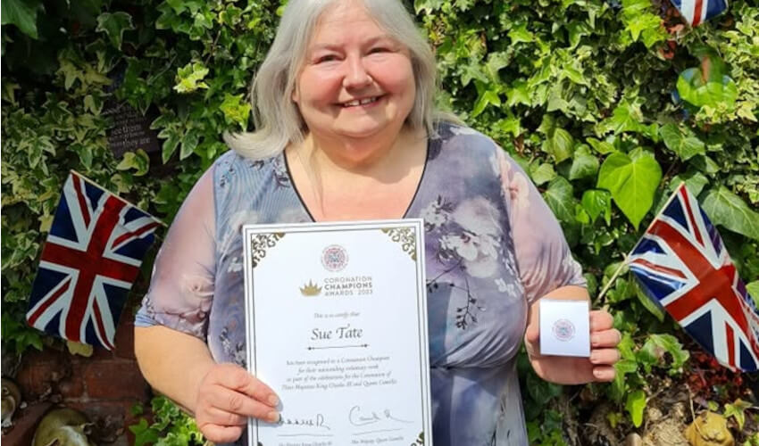 Sue with Coronation Champion certificate and medal