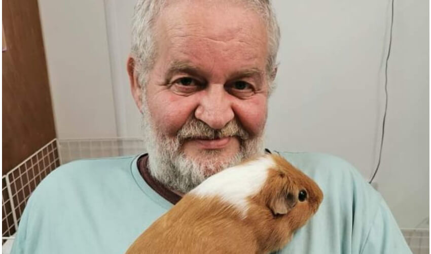 Winston Tate holding guinea pig
