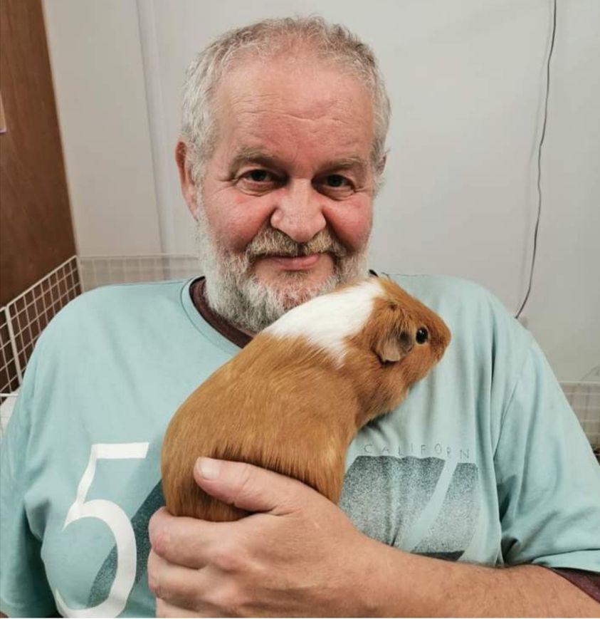 Winston holding a guinea pig